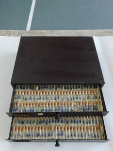 Vintage Metal Storage Drawer With Glass Vials ? Best Fit WATCHMAKING WATCHMAKER TOOLS: Vintage metal storage drawer containing multiple glass vials with cork stoppers. | - Each vial is labeled "Best Fit" with an associated number. | - Drawer includes two compartments for organizing and