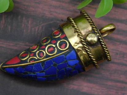 Brass and Mosaic Horn-Shaped Pendant LAPIS LAZULI AND RED CORAL: - Horn-shaped pendant featuring brass accents and colorful mosaic pattern in blue and red. | - Incorporates circular brass details and a loop for attachment to chains or cords. | - Approximate weight:
