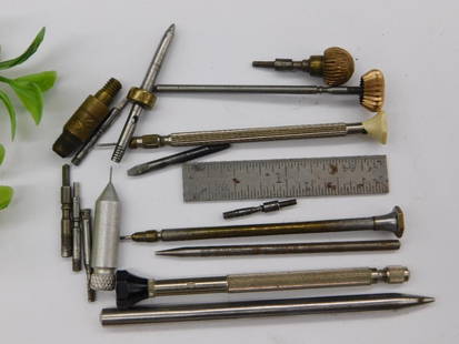Vintage Watchmakers and Precision Tools WATCHMAKER WATCHMAKING TOOLS: - Lot includes a variety of vintage watchmaker's and precision tools. | - Comprises several pin vices, screwdrivers, and small parts with fine tips. | - Made from metal, with some tools featuring bras