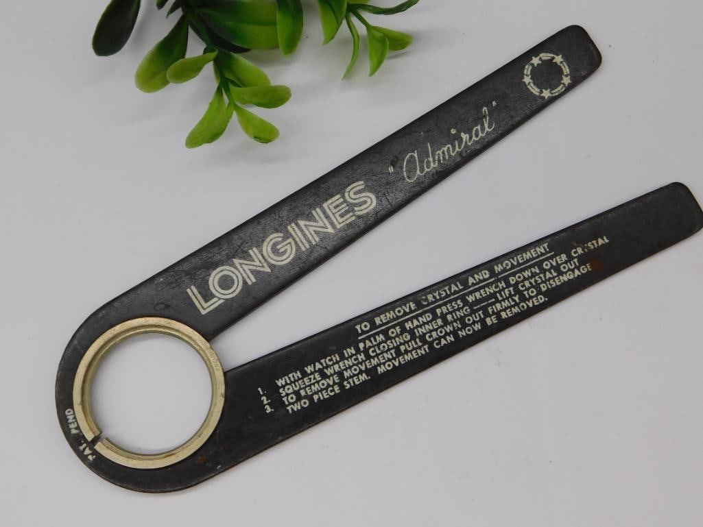 Longines Admiral Watch Tool for Crystal and Movement: Original Longines Admiral watch tool designed for handling crystals and movements. | Made of durable black material with white engraved instructions and branding. | Includes clear step-by-step guideli