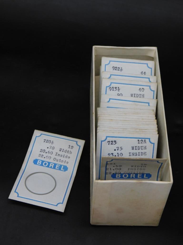 Borel Watch Glasses: Includes a collection of assorted Borel watch glasses. | Labeled with detailed specifications, including width, inside, and outside dimensions. | Contains original storage box with compartments for or