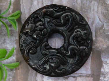 Black Carved Circular Jade Pendant with Swirling Motif