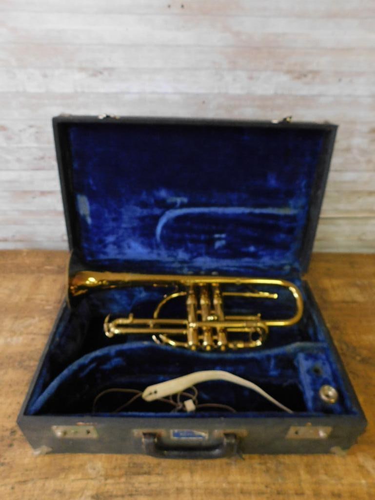 Conn 27A Medium Bore Cornet with Case and Accessories INSTRUMENT: Features a Conn 27A medium bore cornet with serial number visible on the body. Includes three mother-of-pearl valve caps, brass construction with some surface wear. Comes in a protective velvet-lined