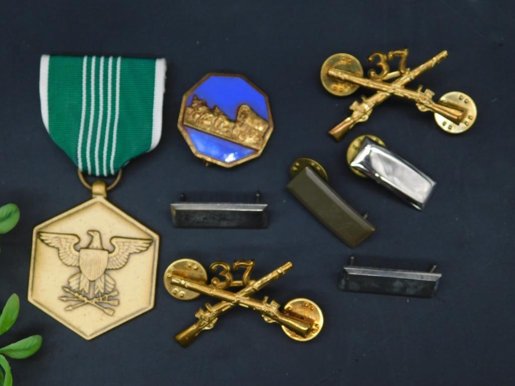 Lot of Military Pins and Service Medal Set: Lot includes a variety of military-themed items, such as one service medal inscribed 'For Military Merit' with a green ribbon, three matching gold-colored crossed weapons pins marked '37,' one octagon