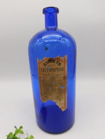 Cobalt Blue Glass Bottle with Elixir Lactopeptine Label