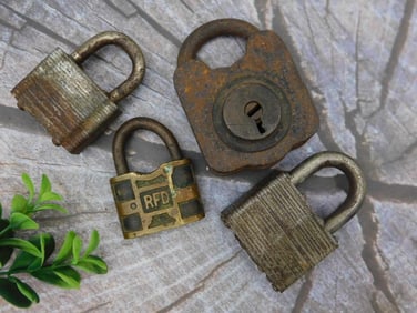 Four Vintage Rusted Padlocks in Various Sizes