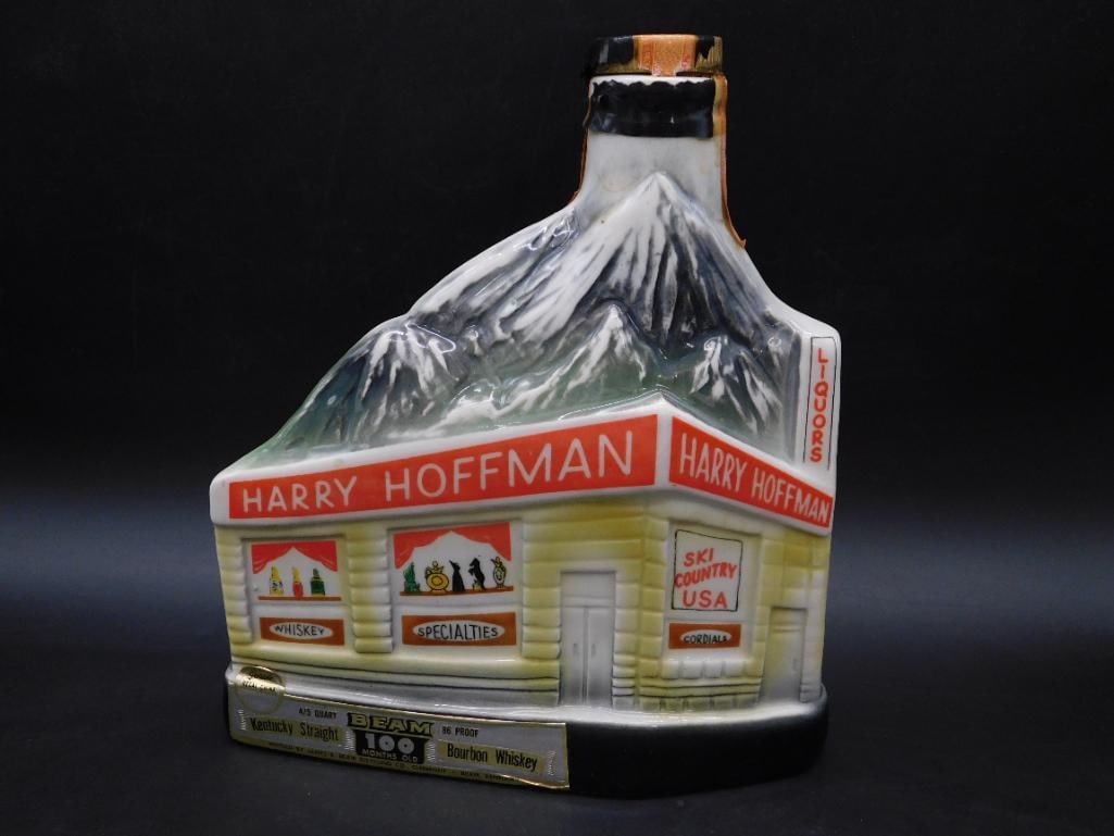 Harry Hoffman Beam Decanter, Ski-Themed, 100 Months Old: - Vintage Beam decanter in the shape of Harry Hoffman's ski-themed building. | - Label indicates Kentucky Straight Bourbon Whiskey, 86 proof, aged 100 months. | - Marked "Genuine Regal China" on the f