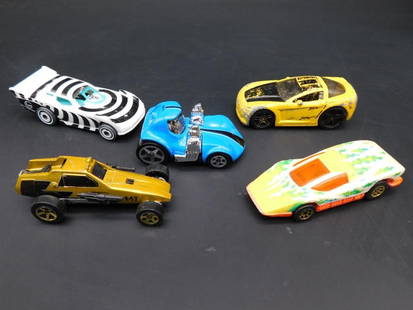 Lot of Five Hot Wheels Die-Cast Cars: This collection features five Hot Wheels die-cast cars with unique designs and details. The group includes a variety of models and manufacturing years, such as the 1978 Silver Bullet, a 2020 Mattel To