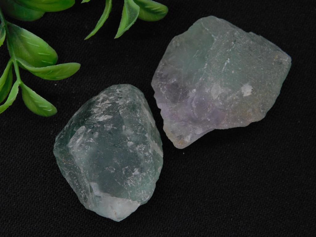Fluorite Rock Stone Lapidary Specimen: This lot includes two rough, unpolished green gemstone specimens with a combined weight of 49 grams. The stones vary in texture and size, adding to their unique appearance. Ideal for collectors or tho