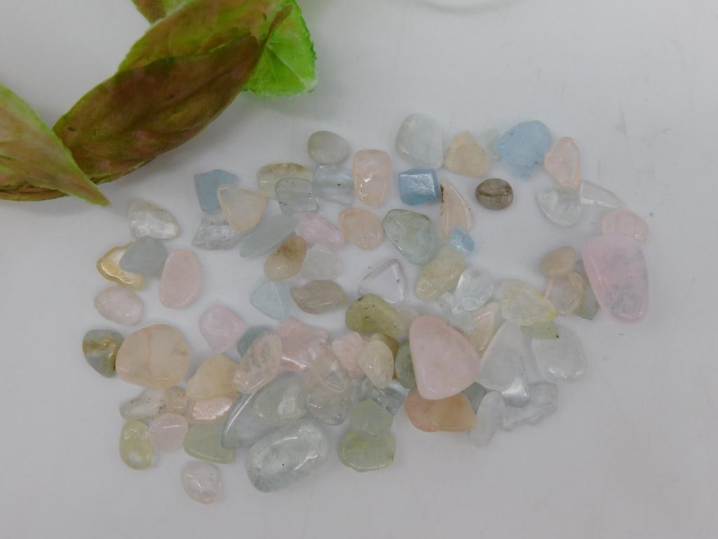 Collection of Mixed Polished Gemstones ROCK STONE LAPIDARY SPECIMEN: A lot of mixed polished gemstones in various colors and shapes. Includes an assortment of stones showcasing pastel shades such as pink, blue, green, and clear tones. The stones appear to be small, as