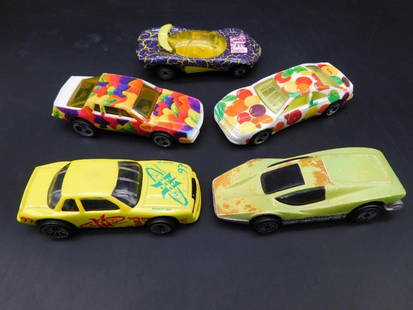 Lot of 5 Mattel Hot Wheels Die-Cast Cars: Set of 5 Mattel Hot Wheels die-cast cars. Includes models dated from 1987, 1989, and 1991, made in Malaysia and China. Features colorful designs, including graphics of fruit patterns, geometric shapes