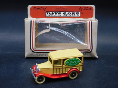 Days Gone by Lledo Model: Poodle Parlour Van with Box: This lot features a 'Days Gone' model vehicle by Lledo, depicting a vintage-style 'Poodle Parlour' van. The diecast model is detailed with yellow bodywork and themed graphics on each side. It comes wi