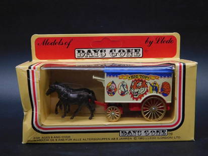 Lledo Days Gone Horse-Drawn Wagon Model 1983 in Original Box: This is a Lledo Days Gone model of a horse-drawn wagon from 1983. It features a colorful "Big Top" circus design, with two black horses and a white-and-red wagon. The piece is in its original packagin