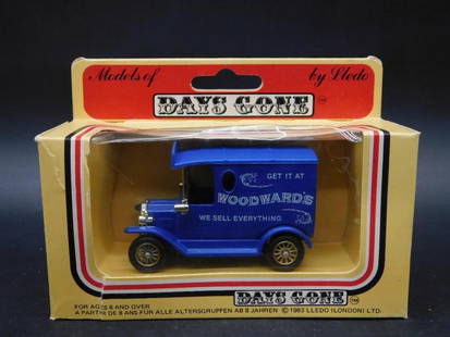 Days Gone Lledo Woodwards Delivery Van: Die-cast metal model delivery van by Lledo from the "Days Gone" series. Branded with "Woodward's" slogan: "We Sell Everything." Packaged in its original box, showcasing detailed vintage vehicle artwor