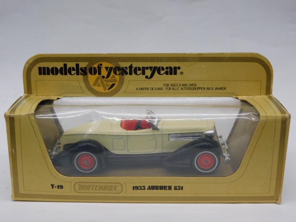 1933 Auburn 851 Matchbox Model in Original Packaging: Matchbox 'Models of Yesteryear' 1933 Auburn 851 die-cast vehicle. Features cream-colored body, red interior, and red-spoked wheels. Packaged in its original box with detailed illustrations. Box shows