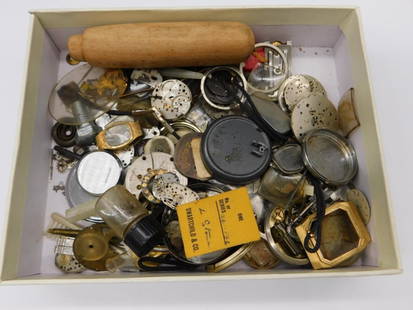 Vintage Watch Parts and Repair Tools Watchmaker Watchmaking Tools: - A mixed lot containing various vintage watch parts. | - Includes watch faces, movements, gears, and bands. | - Contains a variety of materials including metal and plastic. | - Includes a small woode