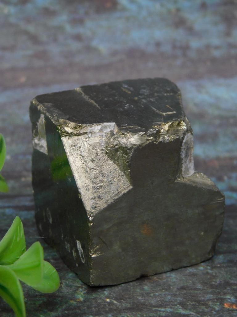 Spanish Pyrite Rock Stone Lapidary Specimen, 176 Grams: This auction features a natural pyrite weighing 176 grams. The specimen showcases a metallic luster and natural cubic formations. Ideal for collectors, it measures prominently, as displayed alongside