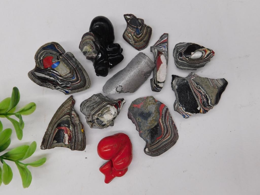 Fordite Motor City Agate Rock Stone Lapidary Specimen: This lot includes a collection of shaped and polished Fordite pieces, often referred to as 'Detroit Agate,' created from layers of automotive paint overspray. The group consists of various siz