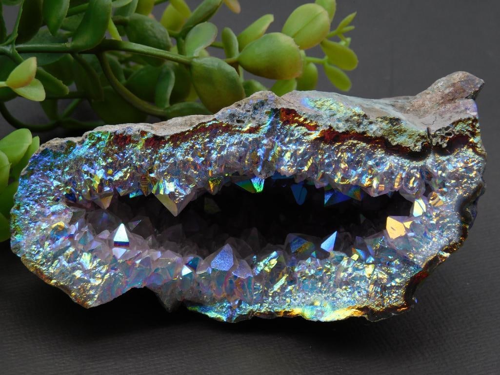 Angel Aura Amethyst ROCK STONE LAPIDARY SPECIMEN: Iridescent geode specimen with vivid, natural colors. | Features a crystalline interior with multicolored reflections. | Exterior displays a rough, natural mineral crust for contrast with the interior