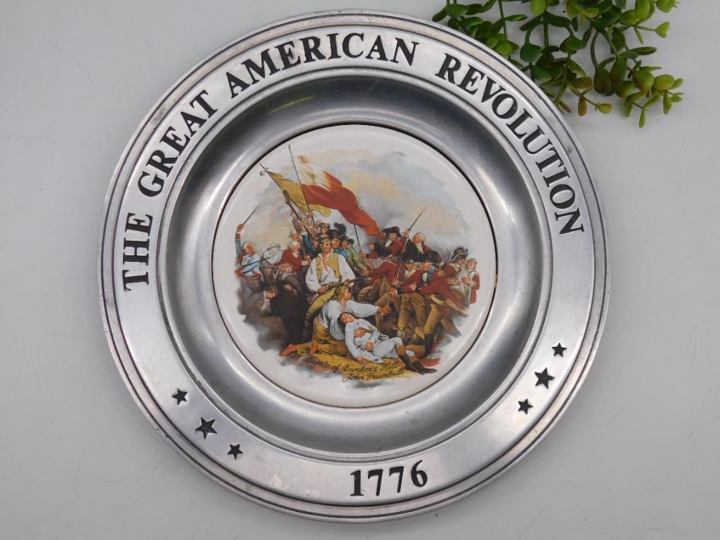 1975 Great American Revolution Plate by John Trumbull: Commemorative plate titled "The Great American Revolution". | Features a depiction of the "Battle of Bunker?s Hill" artwork by John Trumbull. | Outer rim includes text "1776" and "The Great American R