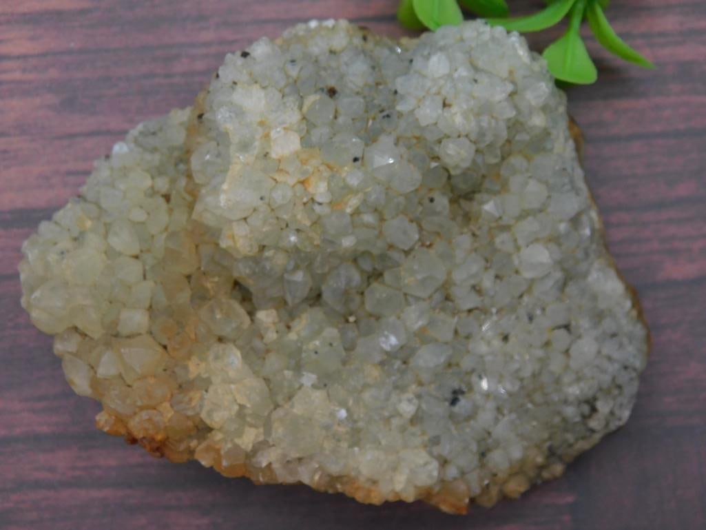 ROCK STONE LAPIDARY SPECIMEN: Natural quartz crystal cluster with translucent pale yellow hue. | Approximate dimensions visible: spans around 4 inches. | Features numerous small, well-formed crystals on a rocky base. | Condition a