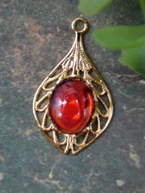 Gold-Tone Pendant With Red Stone