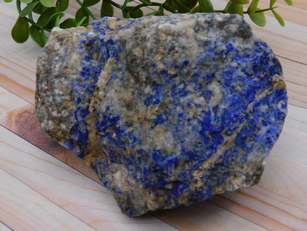 Raw Blue and Gray Lapis Lazuli Mineral Specimen: Raw lapis lazuli mineral specimen showcasing vibrant blue hues with gray matrix inclusions. | Weighs approximately 479 grams as indicated on the label. | Suitable for collectors or geological study pu