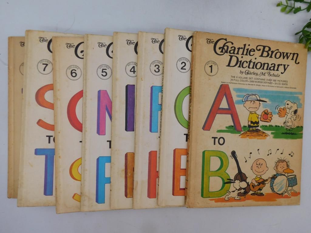 Complete Set of The Charlie Brown Dictionary Volumes (1-8): Complete set of The Charlie Brown Dictionary by Charles M. Schulz. | Includes volumes 1 through 8 (labeled 1 to 8 on covers). | Published by World Publishing, printed in Canada. | Hardcover books with