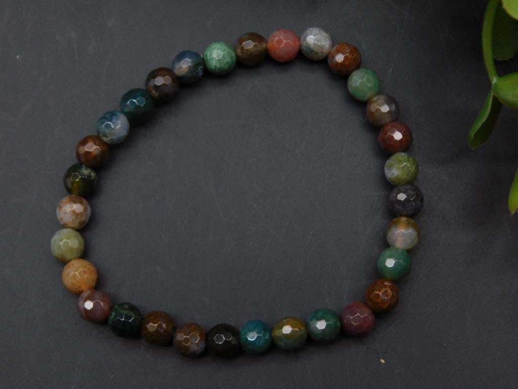 Multi-Color Gemstone Beaded Bracelet ROCK STONE LAPIDARY SPECIMEN: Faceted bracelet featuring colorful gemstone beads. | Beads are uniform in size and display a mix of rich hues. | Elastic cord construction for adjustable and comfortable wear. | Comes without a speci