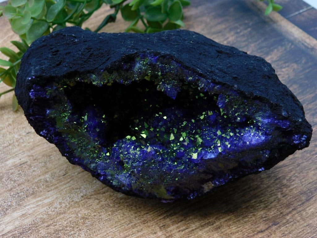 Purple and Gold Geode ROCK STONE LAPIDARY SPECIMEN: Natural mineral specimen featuring a black exterior and vibrant purple and yellow crystalline interior. | Crystals display a shimmering appearance, adding a unique visual element. | Dimensions and wei