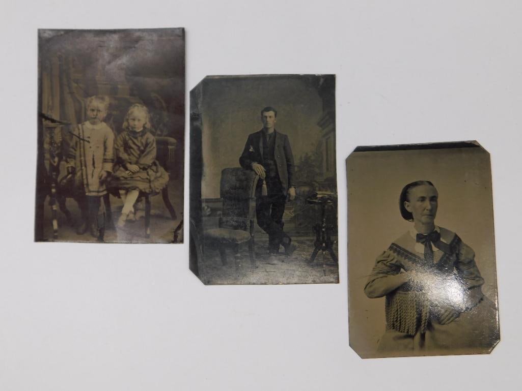 Vintage Tintype Photographs of Individuals and Children: - Lot of three vintage tintype photographs. | - Features two children in one frame, a man posing in a studio setting in another, and a portrait of a woman. | - Tintypes show evident aging and wear con