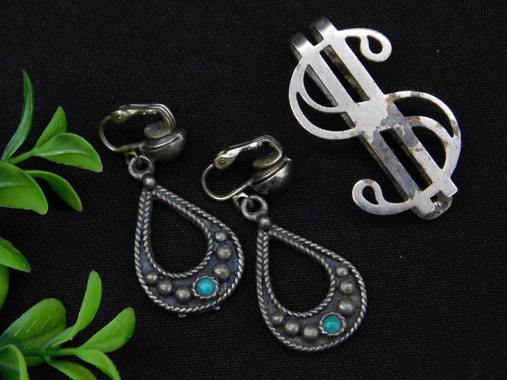 Sterling Silver Earrings and Money Clip: Includes a set of sterling silver earrings and money clip. | - Earrings feature a teardrop design with turquoise stone accents and clip-on backs. | - Brooch features a stylish scroll motif and is mark
