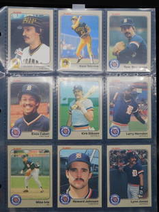 Baseball Trading Cards in Protective Sleeves: - Assortment of vintage baseball trading cards stored in a protective plastic sleeve. | - Featuring players such as Rickey Henderson, Lynn Jones, Howard Johnson, and others. | - Cards include both fro