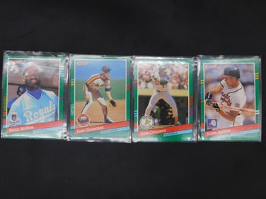 Four Baseball Trading Cards in Protective Sleeves