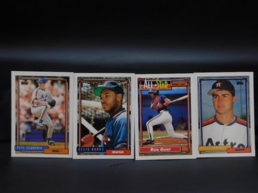 Four 1991 Topps Baseball Cards in Sleeves