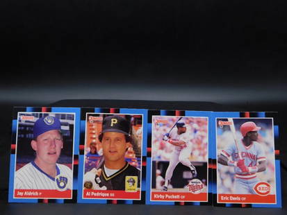 1988 Topps Baseball Cards Featuring Notable Players: - Lot includes four 1988 Topps baseball cards. | - Players featured: Jay Aldrich, Al Pedrique, Kirby Puckett, and Eric Davis. | - Each card displays player images and team affiliations on the front. |