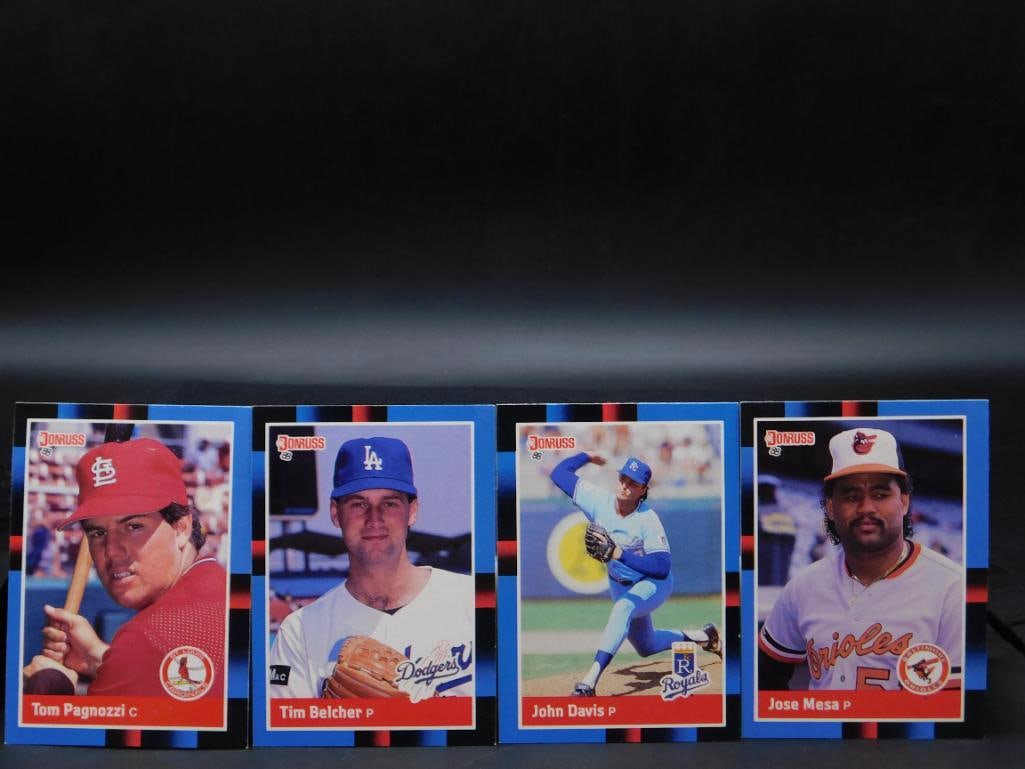 4 Donruss Baseball Player Trading Cards: - Includes four Donruss baseball trading cards. | - Features players Tom Pagnozzi, Tim Belcher, John Davis, and Jose Mesa. | - Clear color images on the front with corresponding player information and