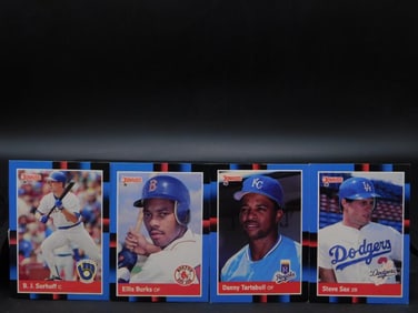 4 Topps Baseball Cards Featuring Various Players