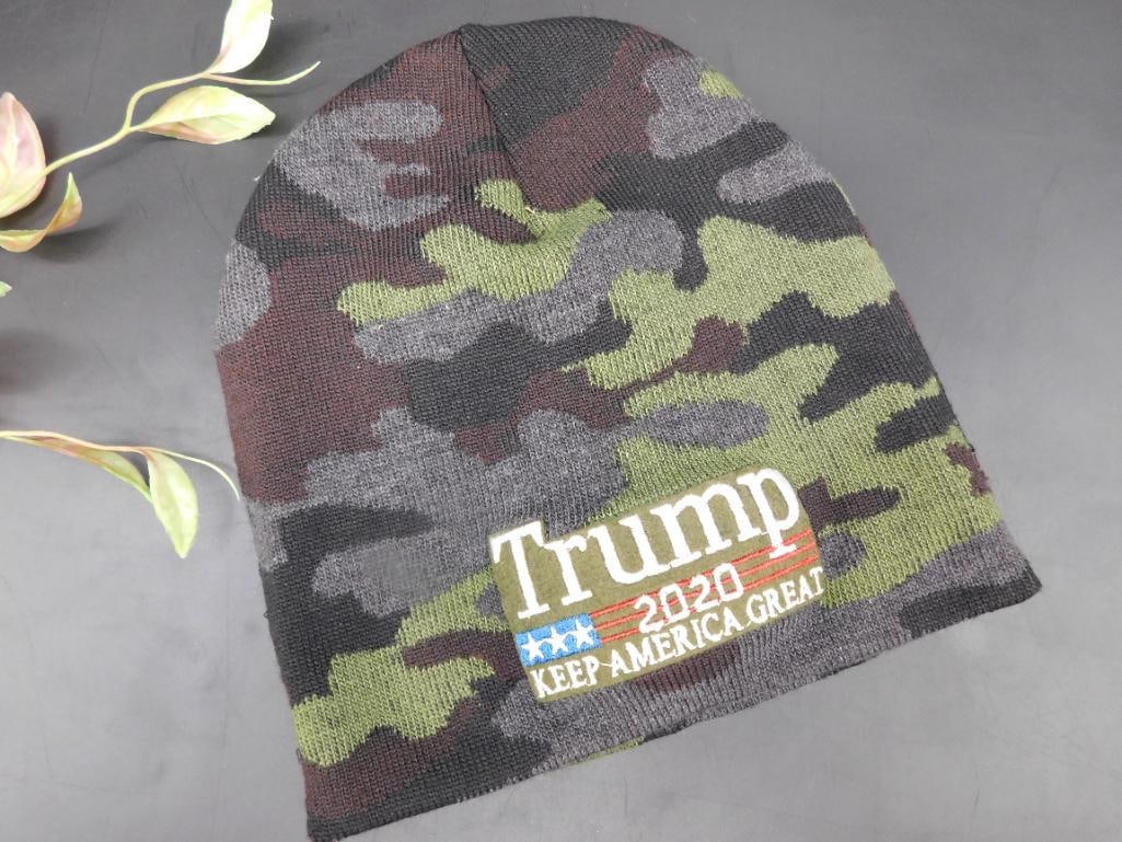 Trump 2020 Camouflage Knit Beanie: Camouflage knit beanie featuring the embroidered text 'Trump 2020 Keep America Great' with patriotic stars and stripes design. Ideal for casual wear or themed events. Durable and stretchable m