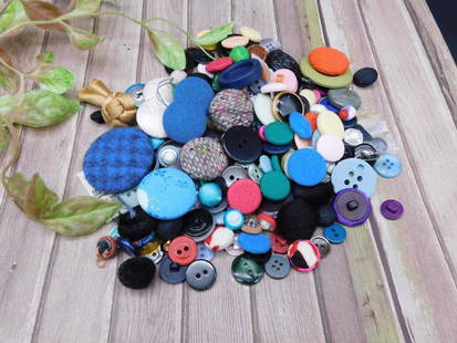Assorted Lot of Mixed Buttons with Varied Designs: This lot includes an assortment of buttons in various sizes, shapes, and designs. The collection features fabric-covered, plastic, and metallic buttons in an array of colors. Ideal for crafting or des