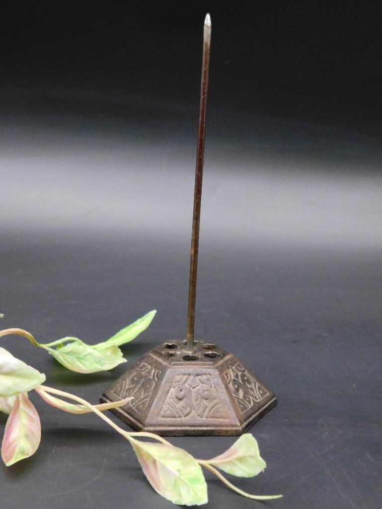 Cast Metal Receipt Spike with Decorative Base: Cast metal receipt spike with a long vertical pin and a decorative weighted base. Ideal for collecting receipts or notes. Includes ruler in the image for scale reference.<