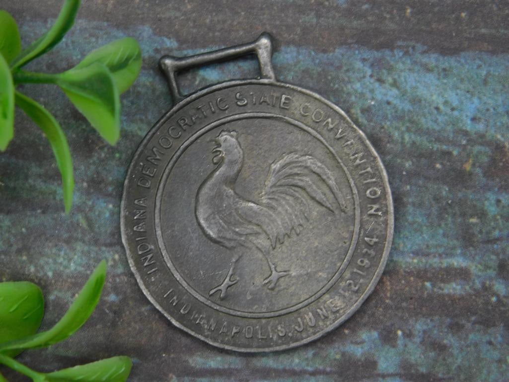 Indiana Democratic State Convention 1962 Watch Fob: This is a metal commemorative medal from the Indiana Democratic State Convention held in June 1962 in Indianapolis. The front of the medal features a rooster motif surrounded by the event?s name and d