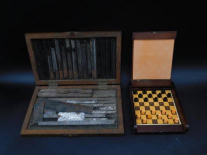 Set of Metal Tools in Wooden Box and Checkers Game: This lot includes a set of assorted metal tools housed in a wooden box and a portable checkers game set. The wooden box contains several metal tools and implements, some showing signs of corrosion. Th