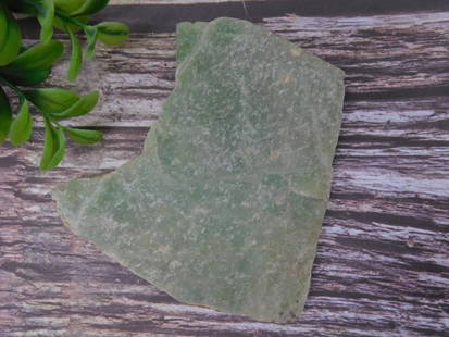 Aventurine Rock Sample for Collectors Rock Stone Lapidary Specimen: Green rough stone weighing 98 grams. Features natural textures and coloration, making it ideal for collectors or enthusiasts. Includes a label indicating it is part of the 2024 Rock Auction, lot numbe