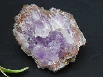 Raw Amethyst Cluster Rock Specimen for Collectors: Natural raw amethyst cluster featuring vibrant purple crystal formations. Its exterior showcases a rough mineral matrix and crystalline interior. Perfect for collectors or enthusiasts. Compact and lig
