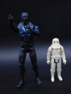 Two Action Figures Including Marked 1980 Hong Kong Figure: - Includes two plastic action figures. | - One figure is marked ? 1980 L.F.L. Hong Kong on the leg. | - The second figure appears to be a modern black and blue humanoid design. | - Figure marked 1980