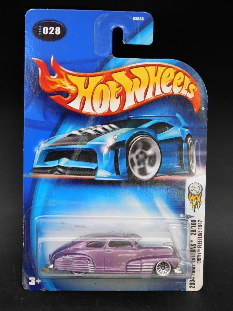 Hot Wheels 2004 First Editions Chevy Fleetline 1847: Hot Wheels 2004 First Editions Chevy Fleetline 1847, number 28 out of 100. The car is presented in its original sealed packaging, which shows minor signs of shelf wear. The packaging includes detailed