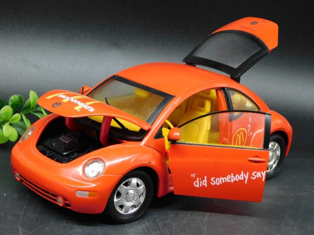 1999 Volkswagen Beetle McDonald?s Diecast Model ? 1:18 Scale: - Diecast model of a 1999 Volkswagen Beetle branded with McDonald's theme. | - Features McDonald's logo and slogan "Did somebody say?" on the car's exterior. | - Scale: 1:18, manufactured by Mattel in