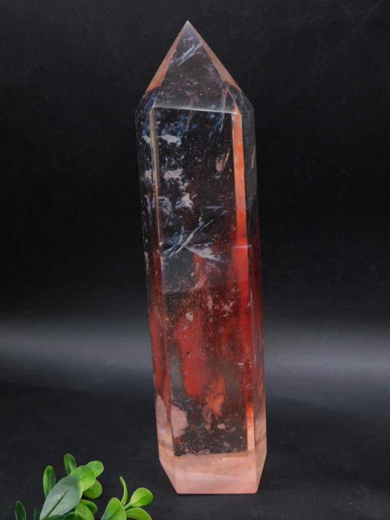 Red and Clear Quartz Crystal Point Rock Stone Lapidary Specimen: - Polished quartz crystal point featuring a red and clear coloration. | - Tapered, double-terminated design. | - Dimensions are marked in reference images for scale. | - Weight label indicates 2 pound