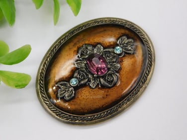 Vintage Oval Brooch with Purple Gem and Floral Motif